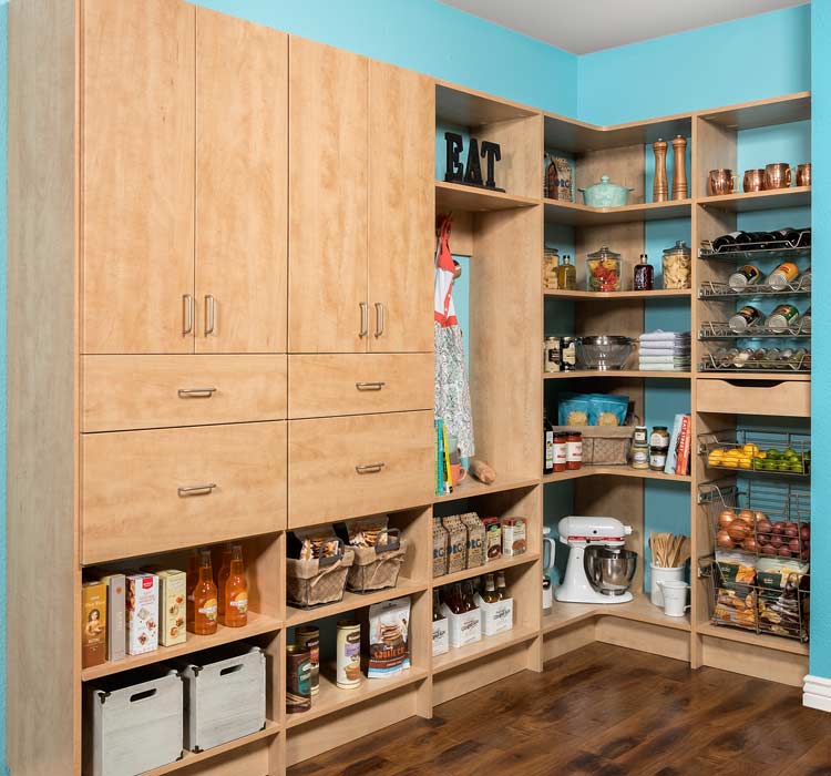 Custom pantry organization system with maple cabinetry, wire baskets, adjustable shelving and corner wrap